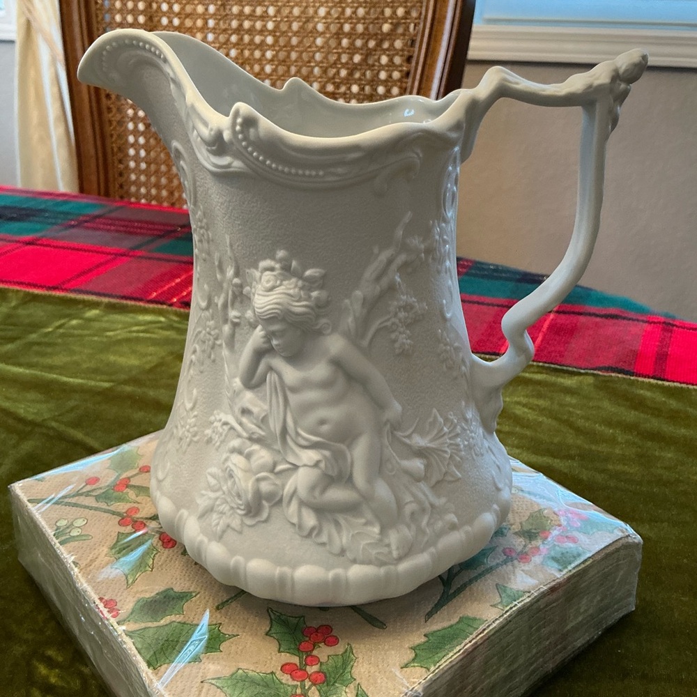 Elegant White Ceramic Pitcher with Cherub Design